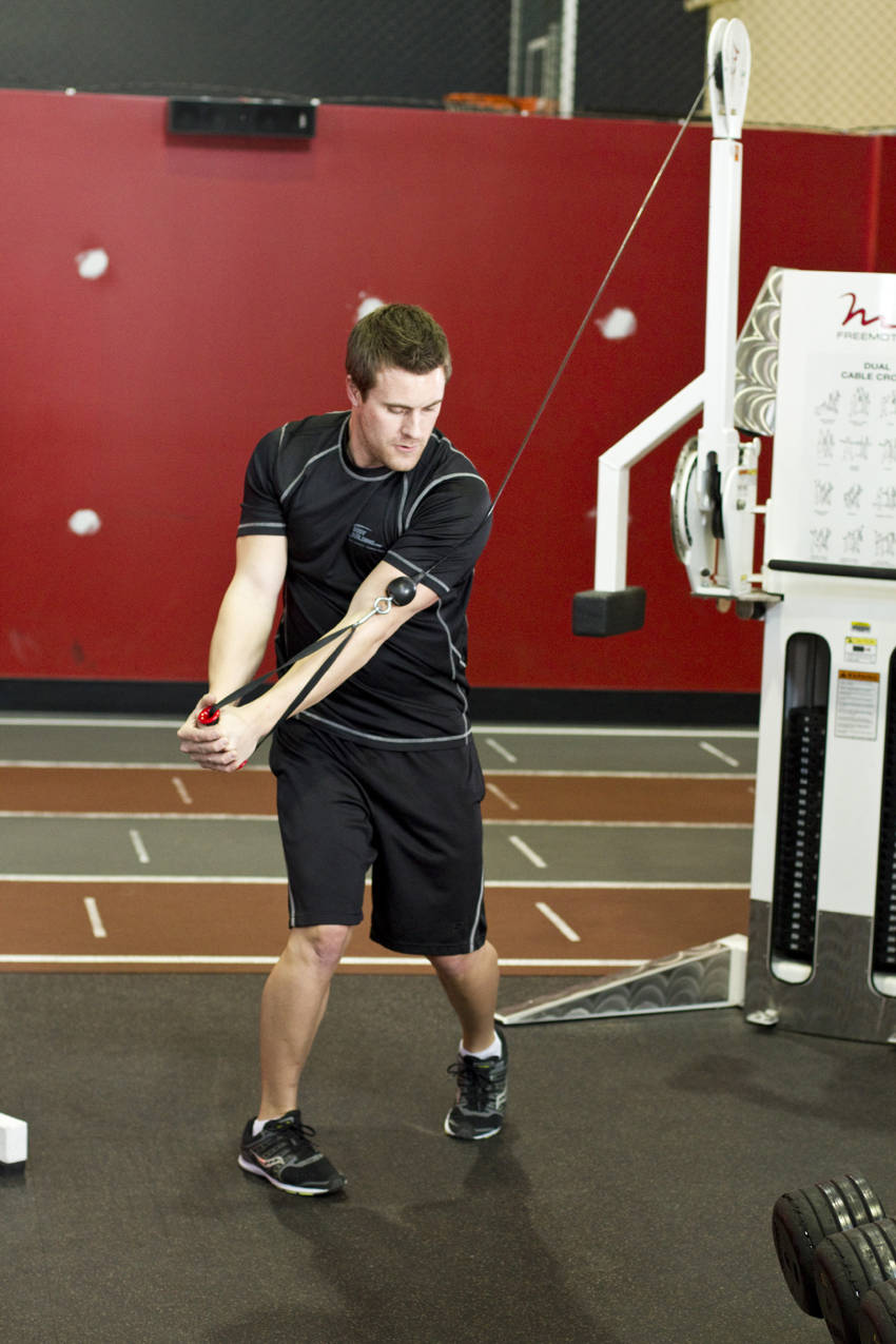 Standing Cable Wood Chop — end position, working the abs
