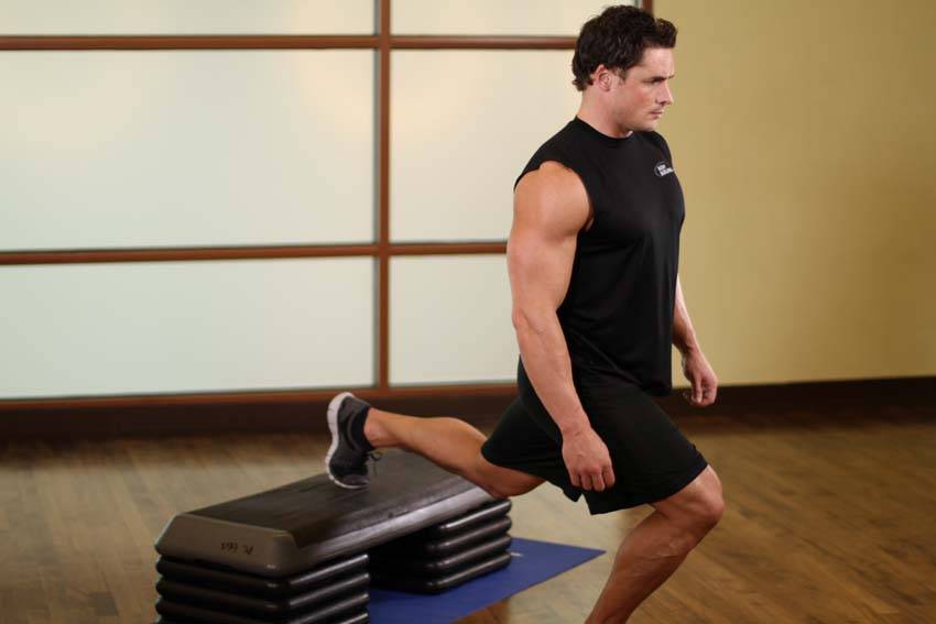 Standing Elevated Quad Stretch — starting position, working the quads