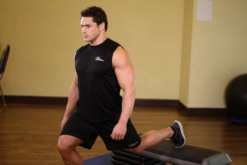 Standing Elevated Quad Stretch — end position, working the quads