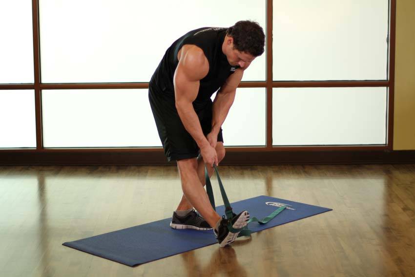 Standing Hamstring and Calf Stretch — starting position, working the hamstrings