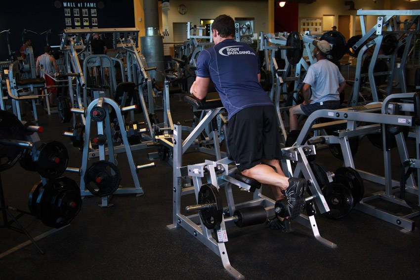 Standing Leg Curl — starting position, working the hamstrings