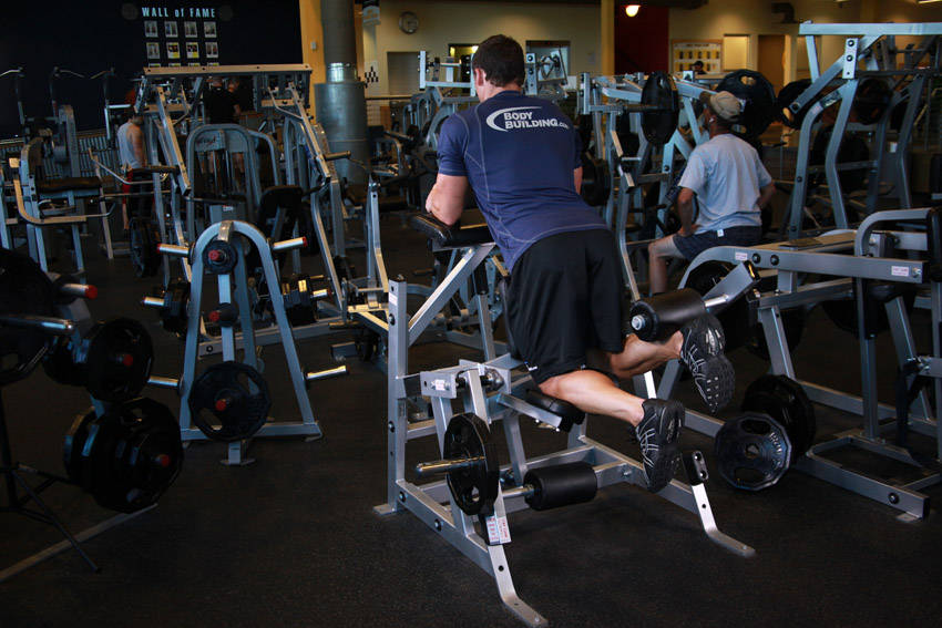 Standing Leg Curl — end position, working the hamstrings