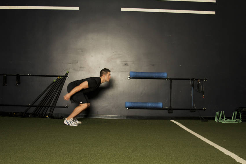 Standing Long Jump — starting position, working the quads