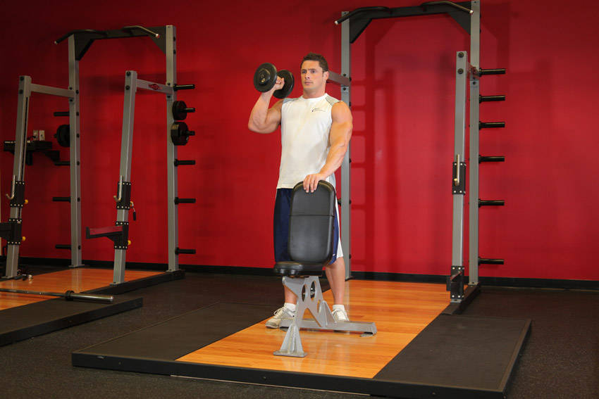 Standing Palm-In One-Arm Dumbbell Press — starting position, working the shoulders