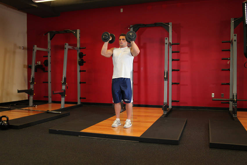 Standing Palms-In Dumbbell Press — end position, working the shoulders