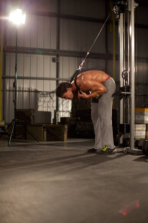 Standing Rope Crunch — end position, working the abs
