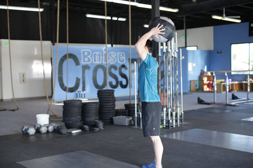 Standing Two-Arm Overhead Throw — end position, working the shoulders