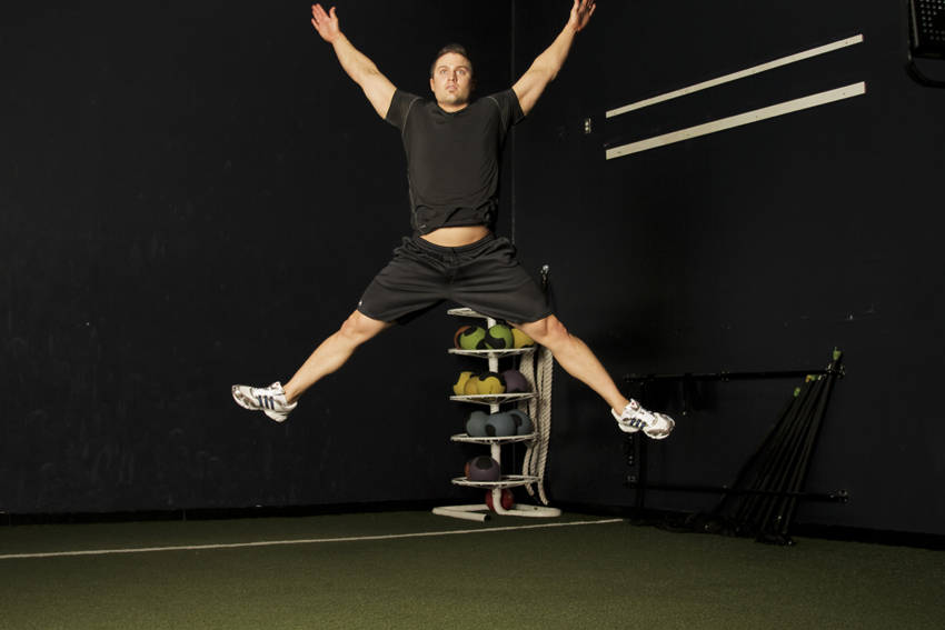 Star Jump — end position, working the quads