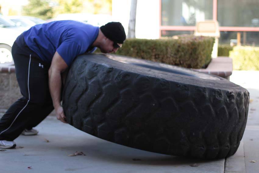 Tire Flip — end position, working the quads