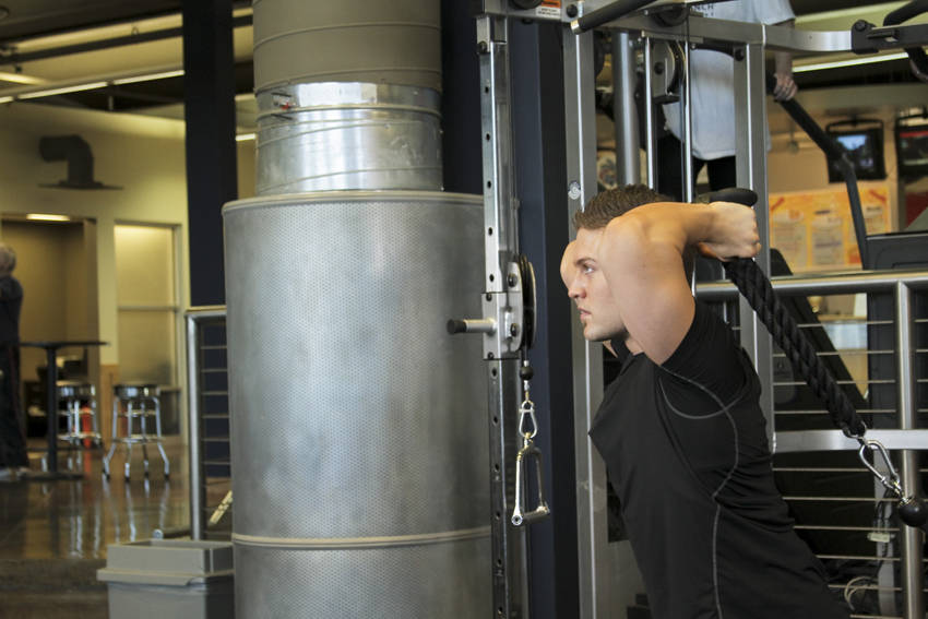 Triceps Overhead Extension with Rope — starting position, working the triceps