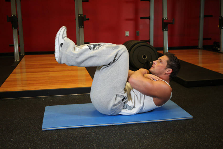 Tuck Crunch — starting position, working the abs