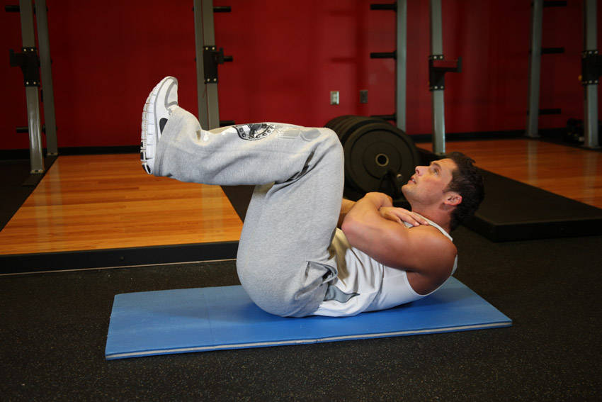 Tuck Crunch — end position, working the abs