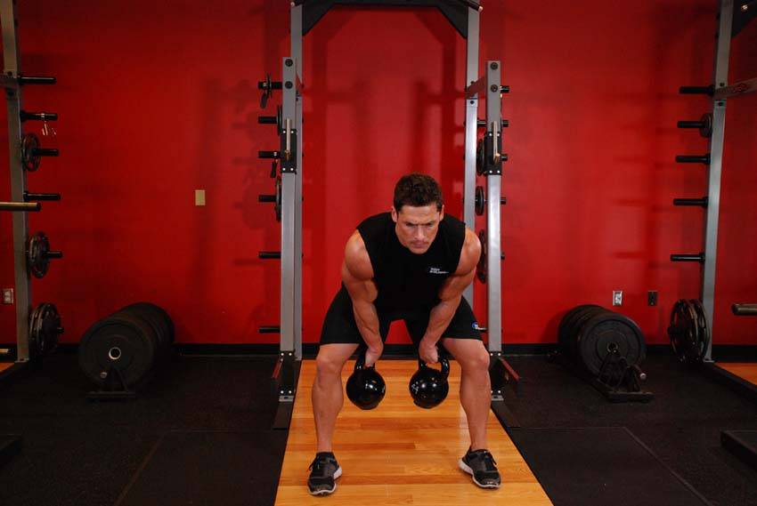 Two-Arm Kettlebell Clean — starting position, working the shoulders