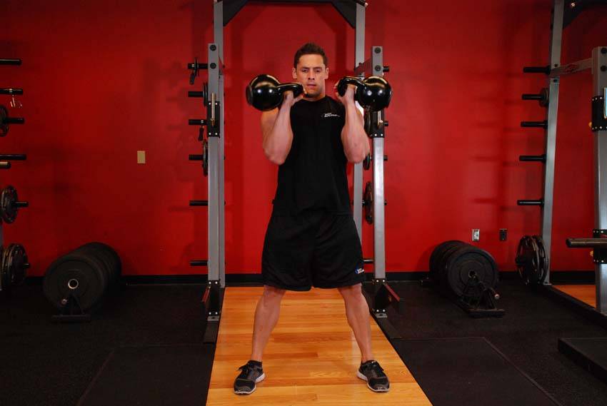 Two-Arm Kettlebell Clean — end position, working the shoulders