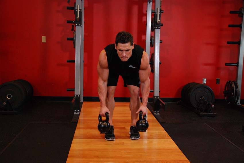 Two-Arm Kettlebell Row — starting position, working the middle back