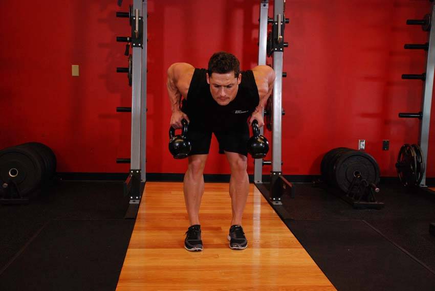 Two-Arm Kettlebell Row — end position, working the middle back