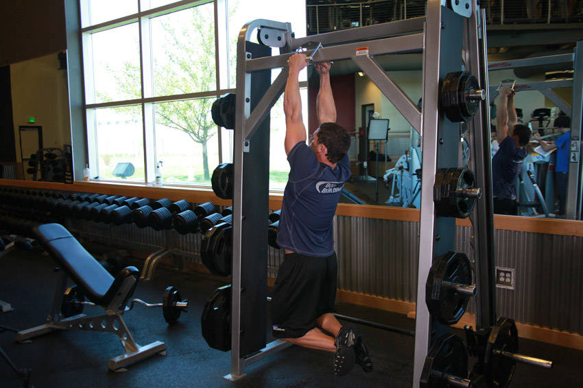 V-Bar Pullup — end position, working the lats