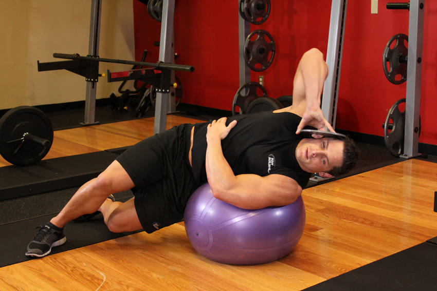 Weighted Ball Side Bend — starting position, working the abs
