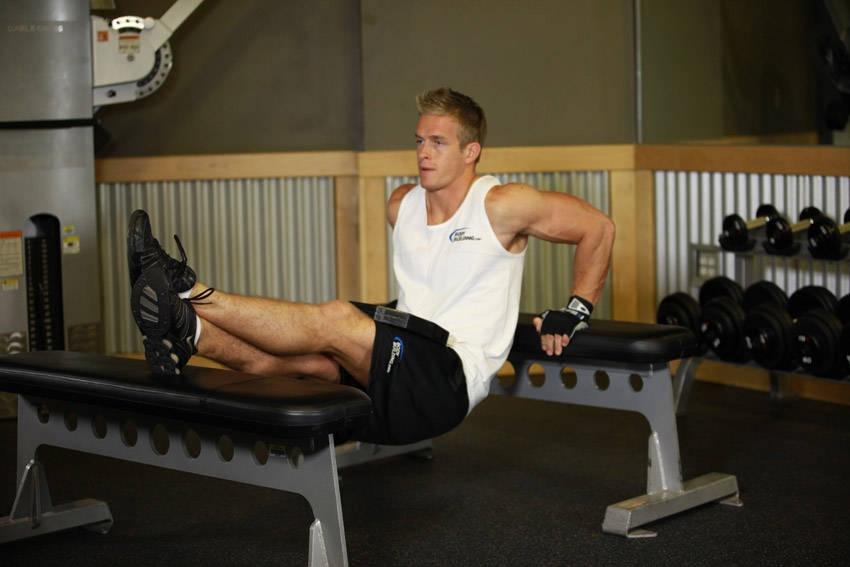 Weighted Bench Dip — end position, working the triceps