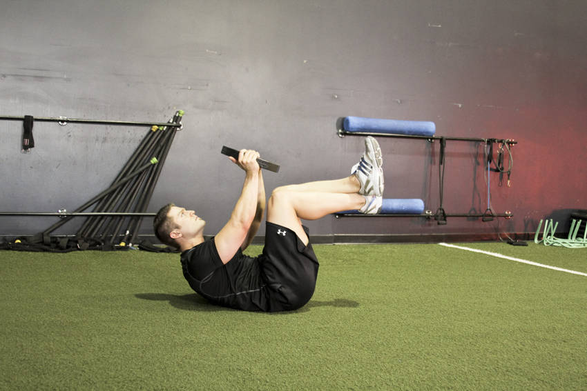 Weighted Crunches — end position, working the abs