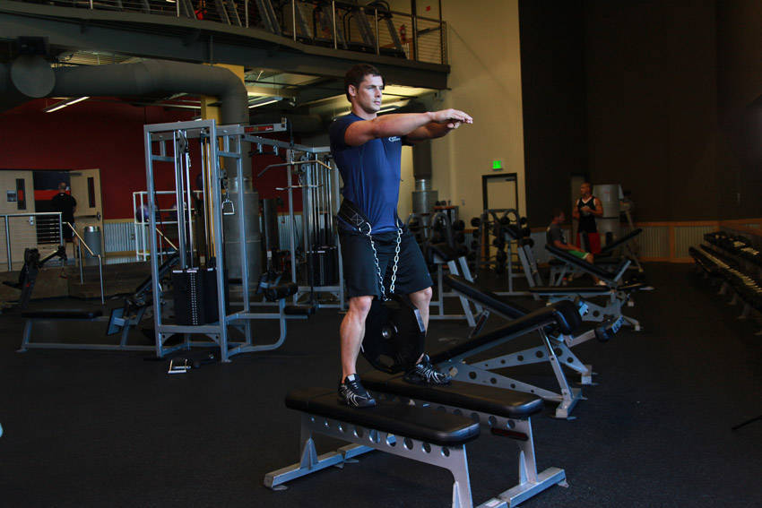 Weighted Squat — starting position, working the quads