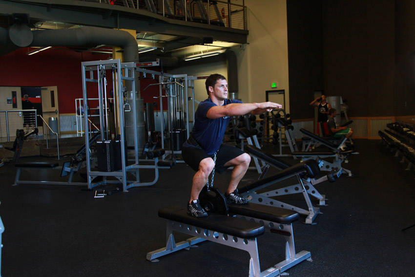 Weighted Squat — end position, working the quads