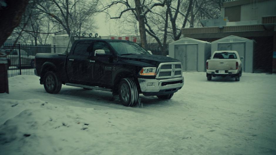 A truck peals away in front of the doctor's office.