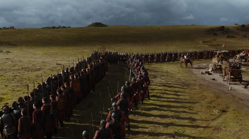 The Lannister soldiers form a line to protect the wagon train.