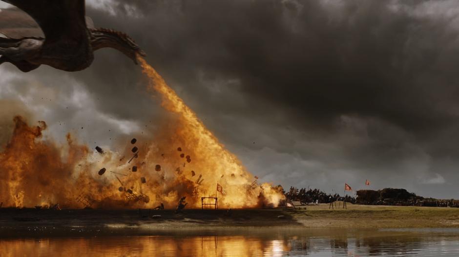 Drogon flies down the baggage train burning everything in his path.