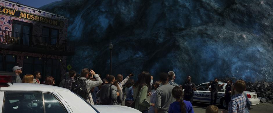 The police try to hold back the crowds who are taking photos of the blob.