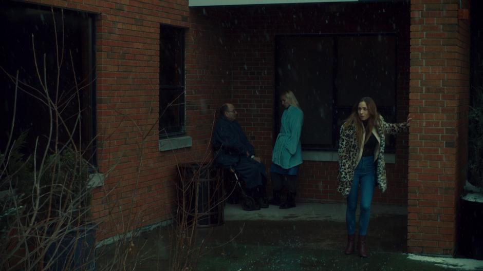 Waverly uses the wall for support as she walks outside to get some air.