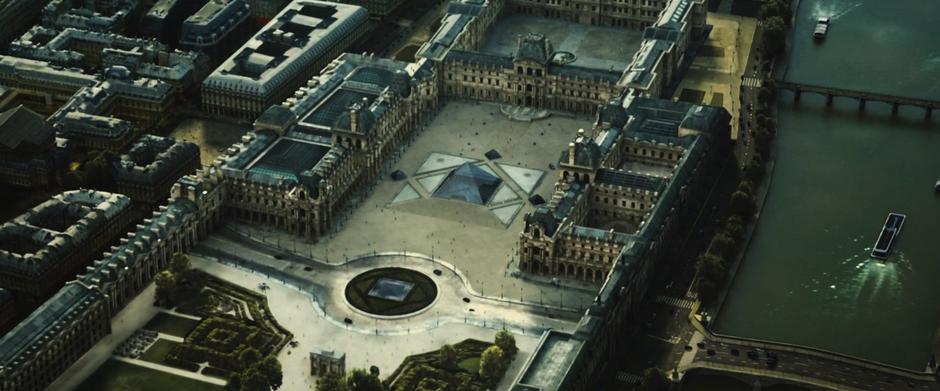 Establishing aerial shot of the Louvre.