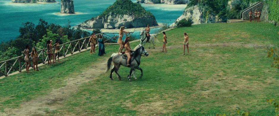 Philippus calls out for Diana while the other Amazons train.