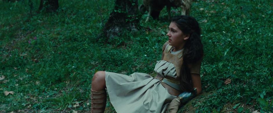 Teenage Diana sits up after being knocked down by Antiope.