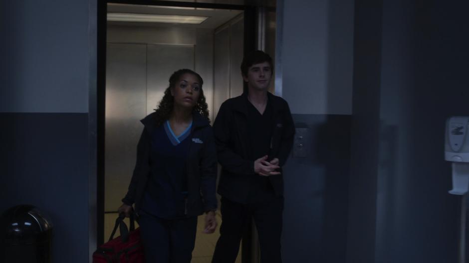 Claire and Shaun walk out of elevator.