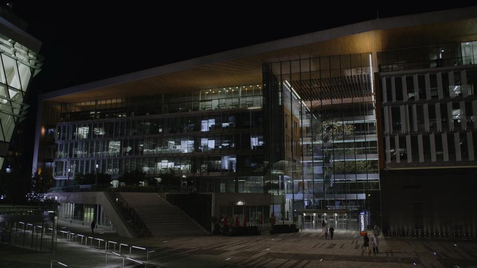 Wide nighttime establishing shot of the exterior of the hospital.