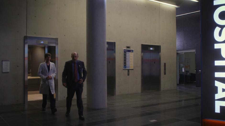 Dr. Glassman leads Shaun into the lobby while talking about his bedside manner.