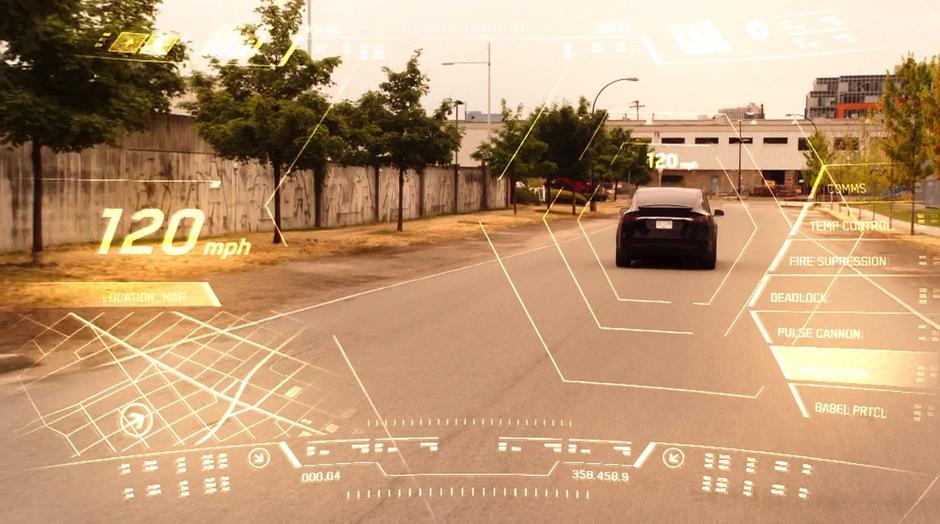 Barry watches the car through his fancy HUD while chasing the car.