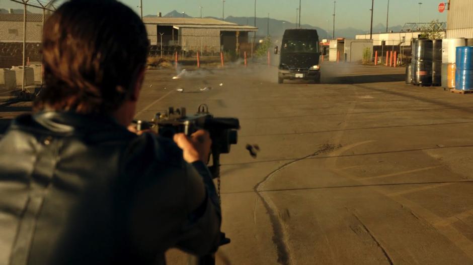 A Bratva with a giant gun fire at the van carrying the delegation.