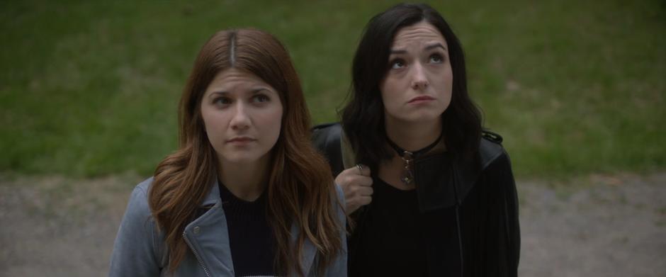 Laura and Carmilla look up at the mansion.