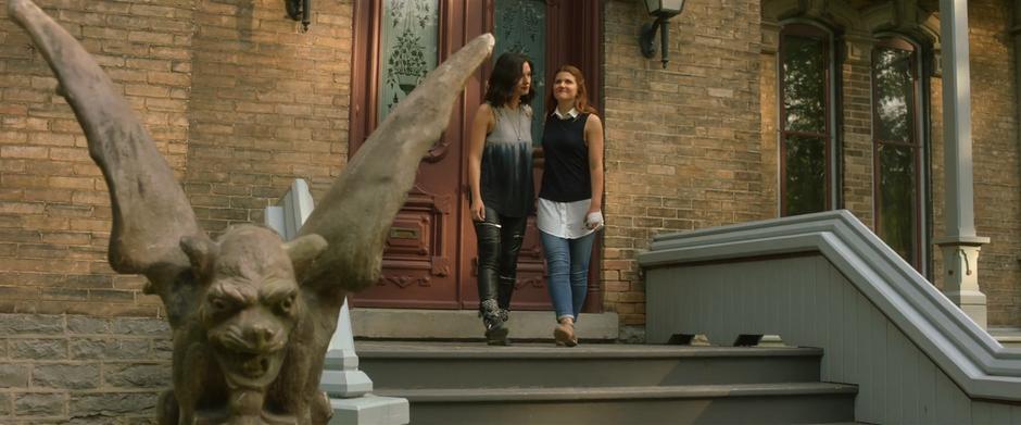 Carmilla and Laura leave the mansion together after sending the ghosts on their way.