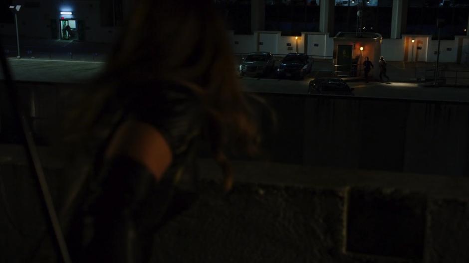 Faust has one of his goons shoot at Dinah from the parking garage roof.