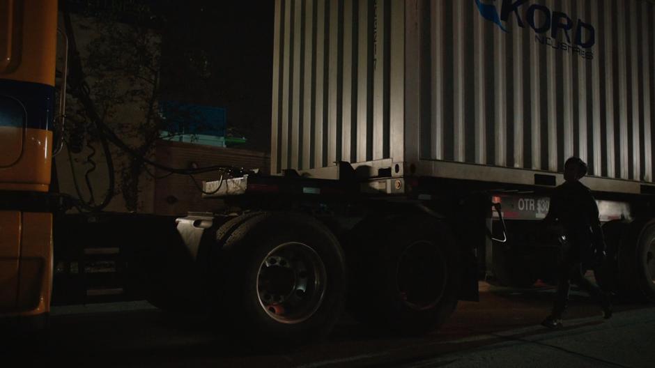 Onyx walks to the front of the truck after incapacitating the three vigilantes.