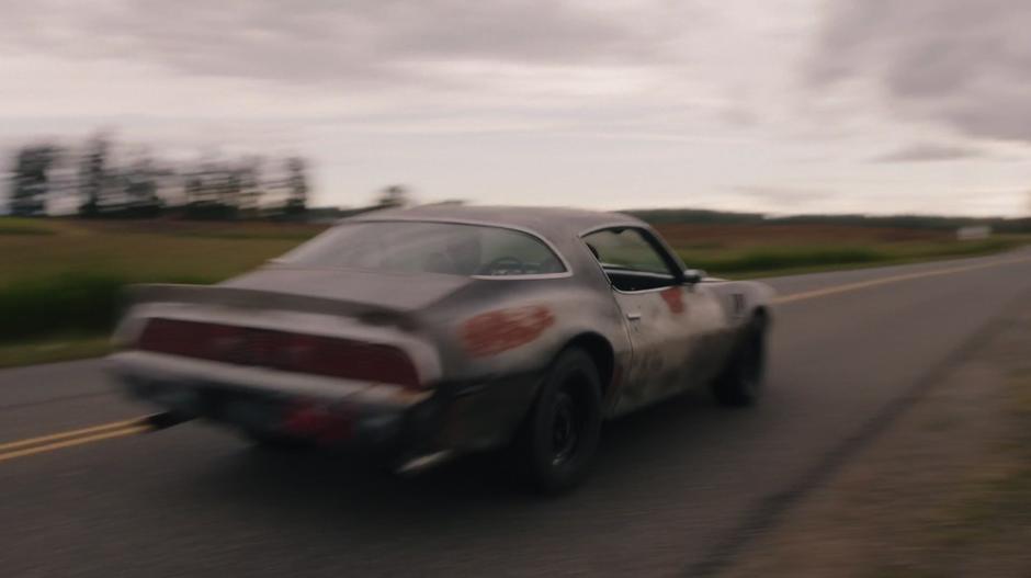 Amanda & Vogel's car drives down the highway.