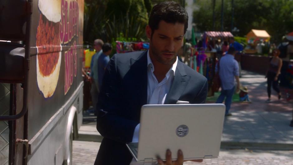 Lucifer updates the information for the kidnappers on his laptop.