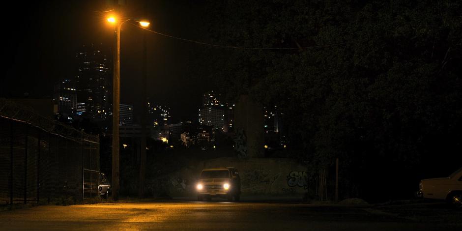 The van turns into an apparently quite industrial area outside of downtown.