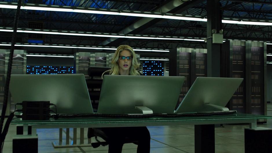 Felicity works in the vault trying to bypass the firewall.
