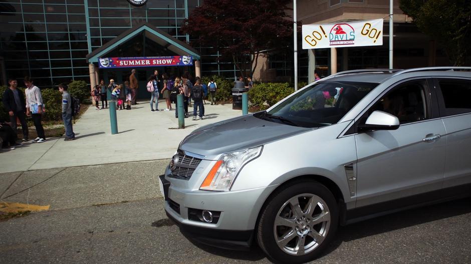 Sam stops in front of the school to drop off Ruby.