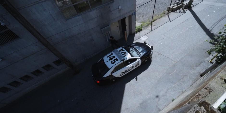 Carly runs to Officer Boyd's squad car.