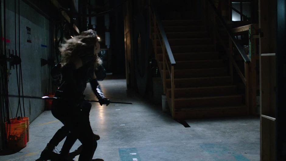 Dinah fights with the Vigilante backstage.